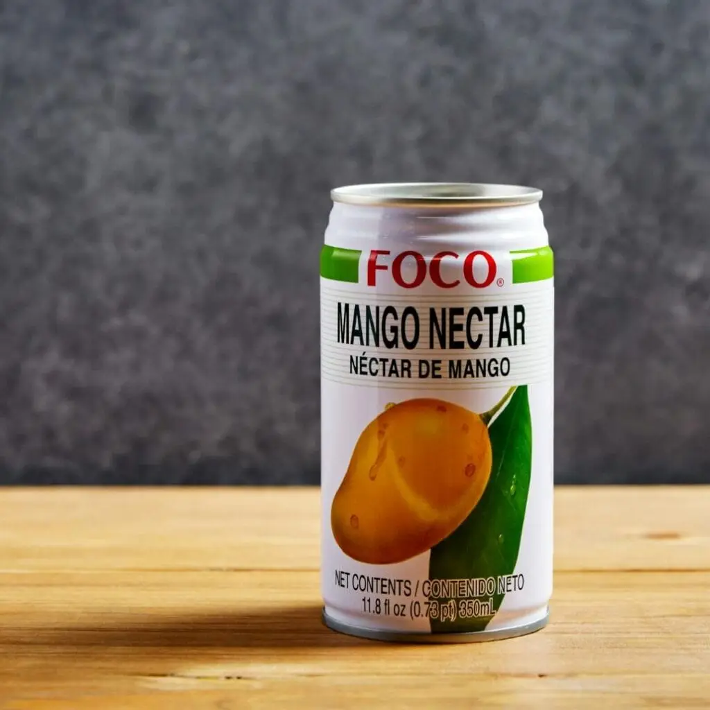 Bangcook – Nectar Mangue, une boisson fruitée et exotique au goût intense de mangue, parfaite pour accompagner vos plats thaï.